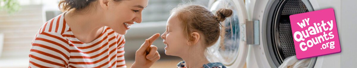 Mother and daughter doing laundry