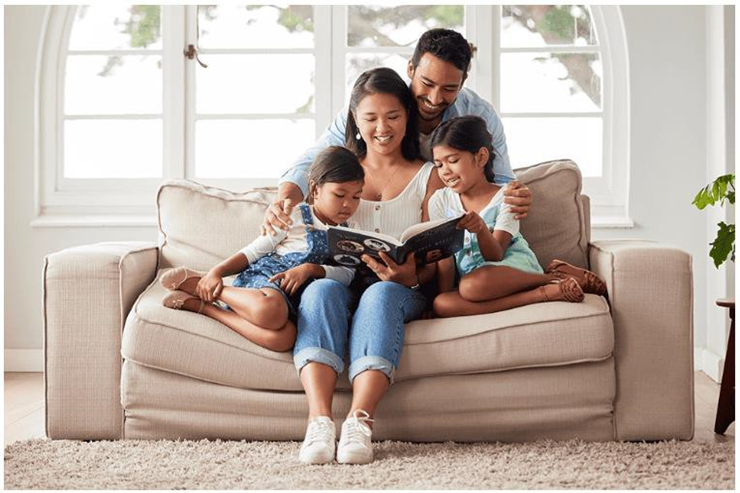 family reading together in living room
