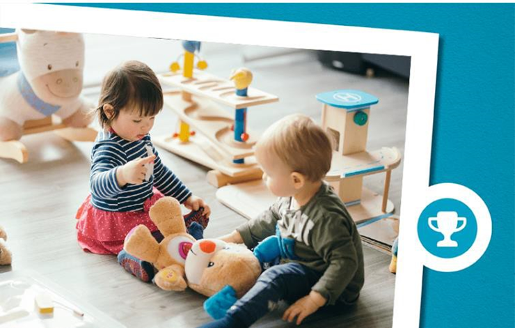 2 kids playing with a stuffed toy