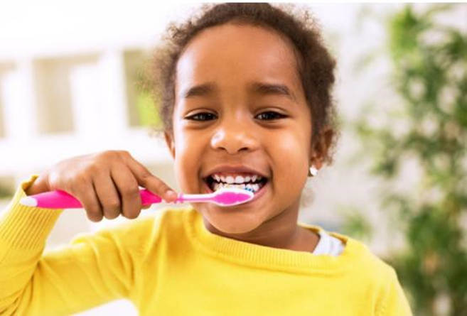 girl brushing her teeth
