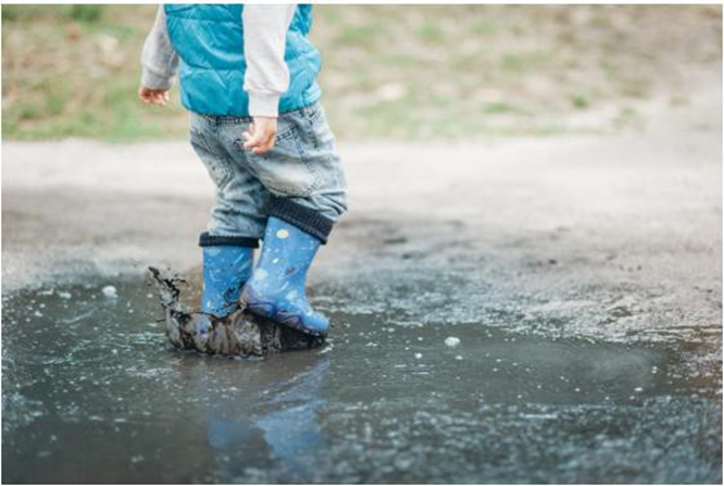 boy playing in the mud