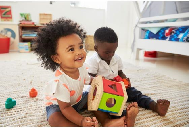 2 kids playing with toys