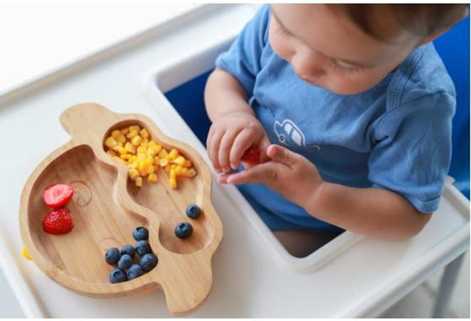 baby playing with his food
