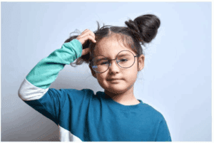 girl scratching her head