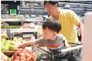dad and son grocery shopping