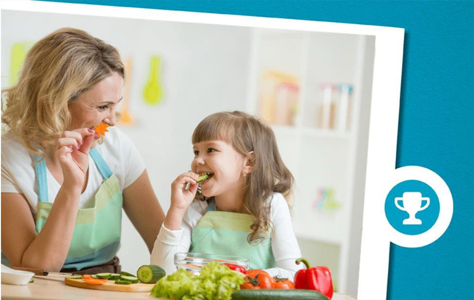 mom and daughter eating vegetable
