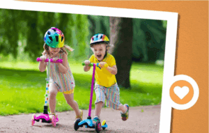 2 kids riding scooters