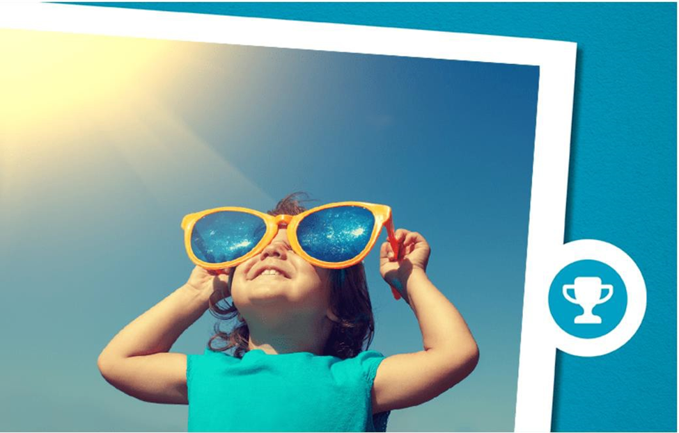 girl wearing giant sunglasses and looking at the sky