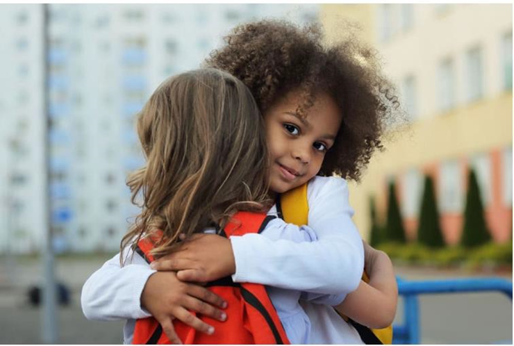 two kids hugging each other