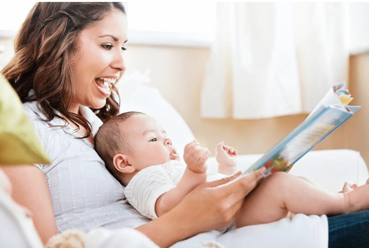 mom reading to her baby boy